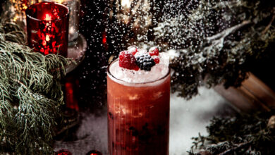 berry juice with ice and berries on top