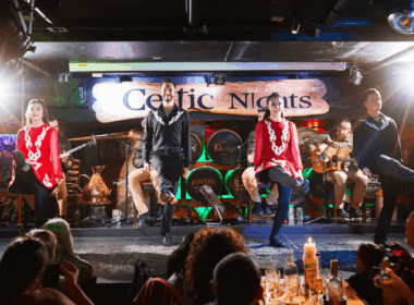 Irish dancers performing on stage at a lively Arlington Hotel bar in Dublin.