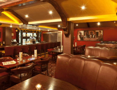 Elegant bar interior with ambient lighting, comfortable seating, and inviting atmosphere.