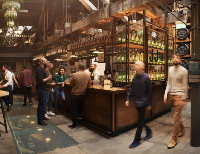 Guests enjoying a lively evening at the stylish Arlington Hotel bar with rustic decor.