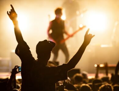 Concertgoers enjoy live music in a lively, vibrant atmosphere at a hotel bar.
