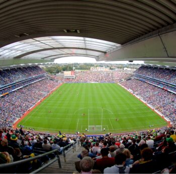A crowded stadium during a sporting event, with spectators filling the stands.