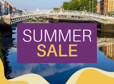 Ha'penny Bridge over calm river with 'Summer Sale' text overlay in Dublin.