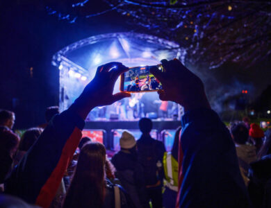 Guests enjoy live outdoor music at Arlington Hotel's vibrant night event.