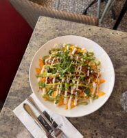 Delicious loaded nachos on a patio table at the Arlington Hotel bar.