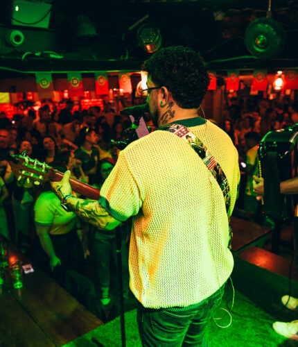 Musicians entertain lively crowd at a vibrant Dublin bar