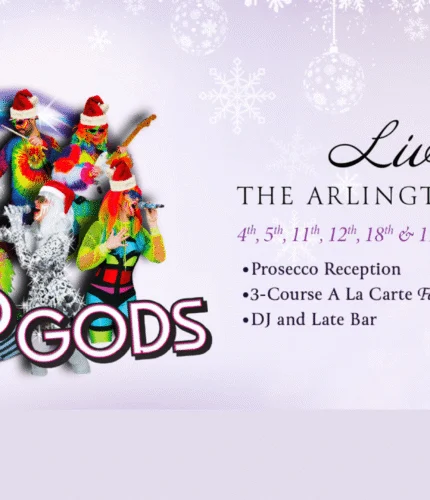 Festive band performing at Arlington Hotel with holiday decor and event details.