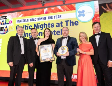 Award ceremony at Dublin hotel's luxurious venue with attendees in evening wear.
