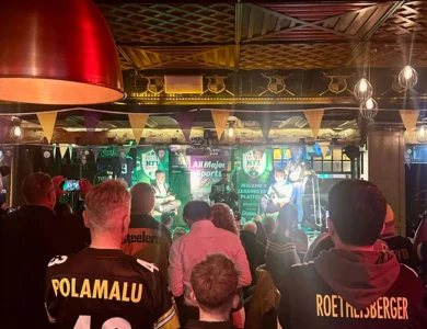 Guests enjoy live music in a lively Dublin hotel bar.